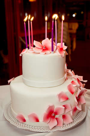 Birthday cake with candles on darck background.の写真素材