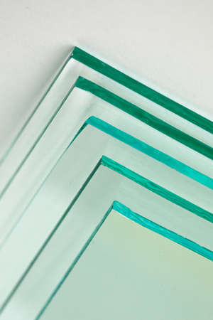 Sheets of Factory manufacturing tempered clear float glass panels cut to sizeの写真素材