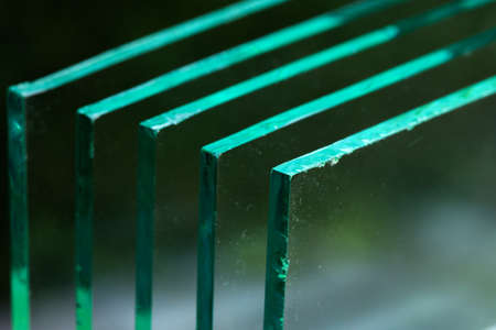 Sheets of Factory manufacturing tempered clear float glass panels cut to sizeの写真素材