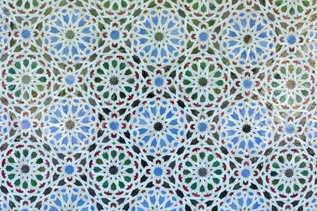 Arabic pattern on a tiled wall of a Muslim building, abstract background and textureの写真素材