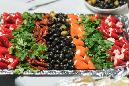 Roasted peppers stuffed with feta cheese, selective focus