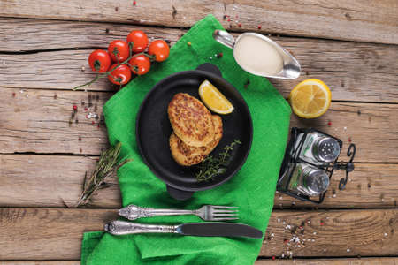 Fried cutlet with dill on a plate