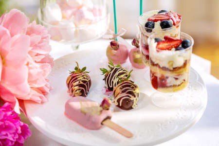 Delicious sweet buffet with cupcakes, Sweet holiday buffet with cupcakes and meringues and other...