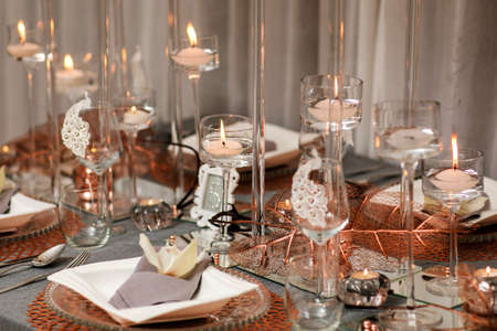 decorations made of wood and wildflowers served on the festive tableの写真素材