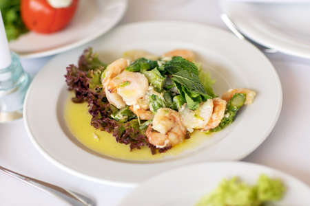 Peeled boiled shrimp meat on ceramic plate.の写真素材