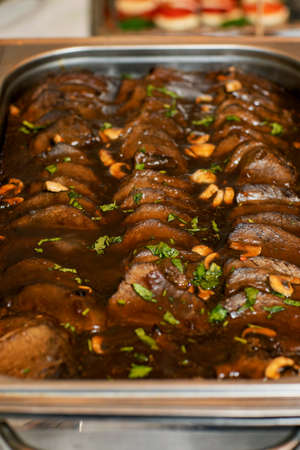 roast veal with sauce on the trayの写真素材