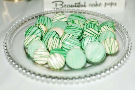 French dessert macaron with vanilla and white chocolate ganache on a white backgroundの写真素材