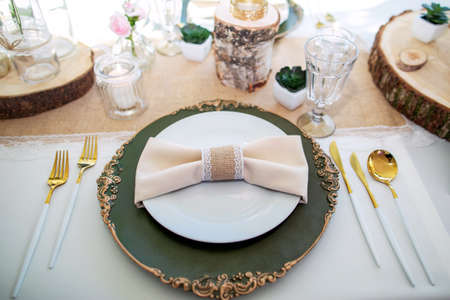 decorations made of wood and wildflowers served on the festive tableの写真素材