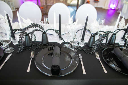 decorations made of wood and wildflowers served on the festive tableの写真素材