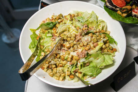 Delicious caesar salad with parmesan cheese, homemade croutons and dressing.の写真素材