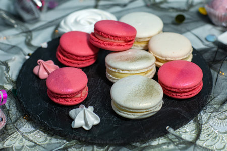 Macaroons. Delicious french desserts. Macaroons with raspberries and cream cheese. Macaroons on the tableの写真素材