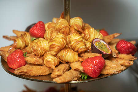 The fried potato spiral on a trayの写真素材