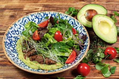 salad mix with avocado and cucumber, with balsamic dressingの写真素材