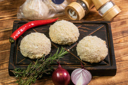 Roasted cutlets from beef and pork meat. Black background. Top viewの写真素材