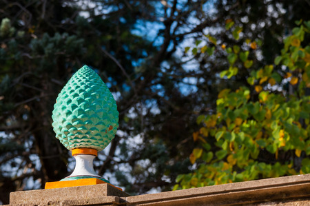 Close-up view of a typical colored pine cone shaped piece of ceramics used as an ornament in the main public gardens of Caltagironeの写真素材