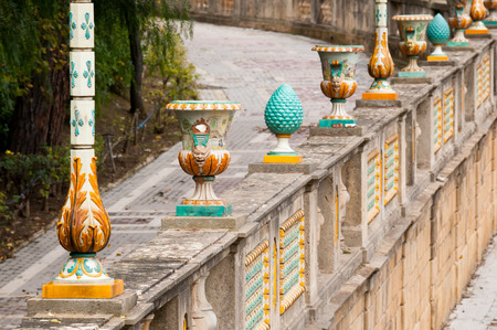 Typical pieces of Caltagirone ceramics  used as a ornament on the wall of the main public gardens of the townの写真素材