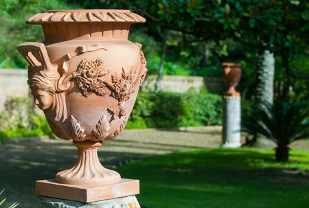 Close-up view of a terracotta vase and its handmade decoration in the public gardens of Caltagironeの写真素材
