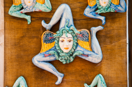 Close up view of some typical sicilian ceramic souvenirs in a street of Castelmolaの写真素材