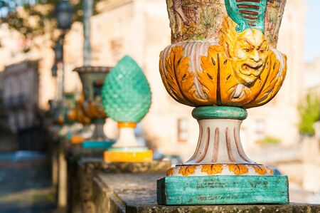 Close up view of one typical ceramic vase from Caltagirone with its motis and designs, used as an ornament along the wall of the main public gardens of the townの写真素材