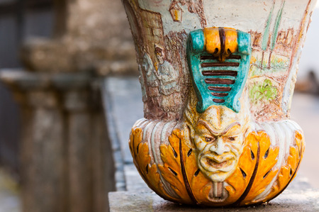 Close up view of one typical ceramic vase from Caltagirone with its motis and designs, used as an ornament along the wall of the main public gardens of the townの写真素材