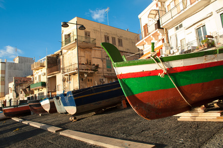 Fishing boats in a dock of the town Acitrezza, a tourist fishing village in Eastsiclyの写真素材