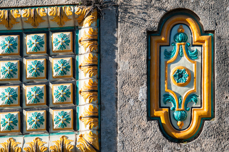 Typical colored tiles from Caltagirone used as an ornament along the wall of the public gardensの写真素材