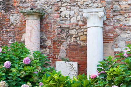 Two of the Roman style columns in the external courtyard of the olimpic theatre in Vicenzaの写真素材