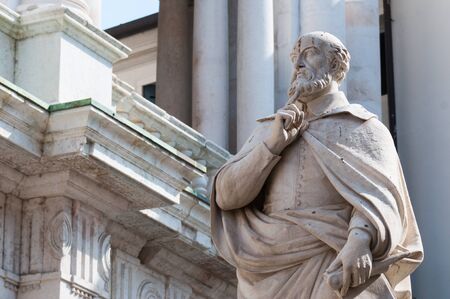 The statue of the famous Italian architect of the Renaissance Andrea Palladio, placed by the Basilica palladiana in Vicenzaの写真素材