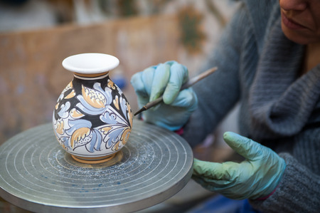 View of a ceramic vase from Caltagirone being decorated by a local artisanの写真素材