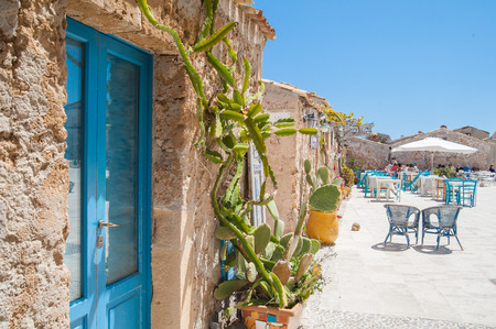 View of a typical rustic house in Marzamemi, a small fisher village in southeastern Sicily, and the main town squareの写真素材