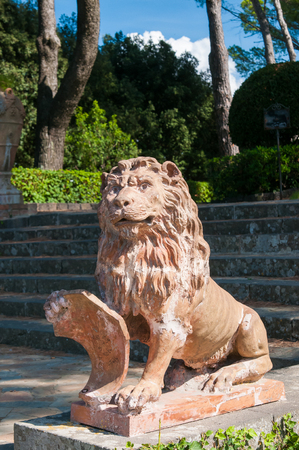Ornamental ceramic statue of a lion in the public gardens of the town Caltagironeの写真素材