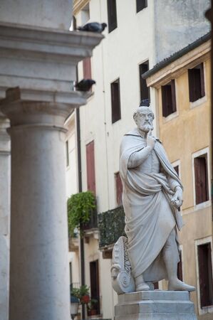 The statue of the famous architect of the Renaissance Palladio near to the Palladian basilica in Vicenzaの写真素材