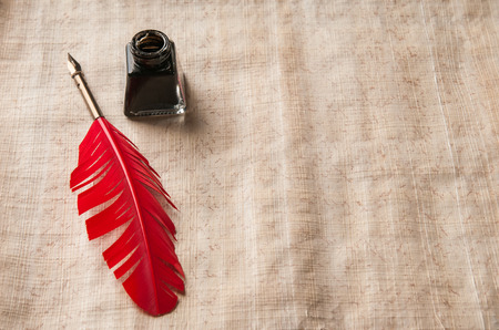 Quill pen on a papyrus sheetの写真素材