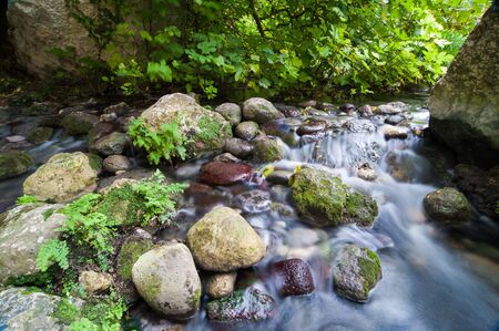 Water stream inside the canyon in the necropolis of Pantalica, Eastsicilyの写真素材