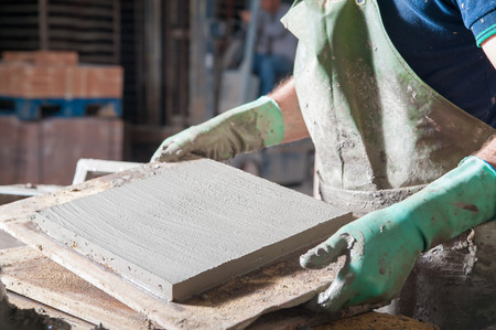 Just squared tiles made of clay and lavic sand ready to be fired