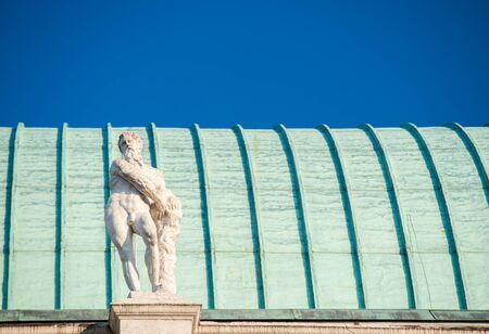 Statues on the top of the Basilica palladiana, the main monument of the town Vicenzaの写真素材