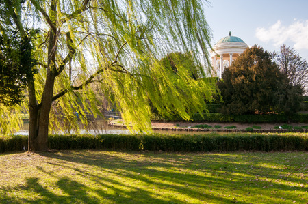 Willow and the small temple of Querini park in Vicenza at sunsetの写真素材