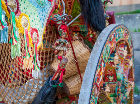 Close up view of a colorful harness with tassels of a typical sicilian cart during a folk festivalの写真素材