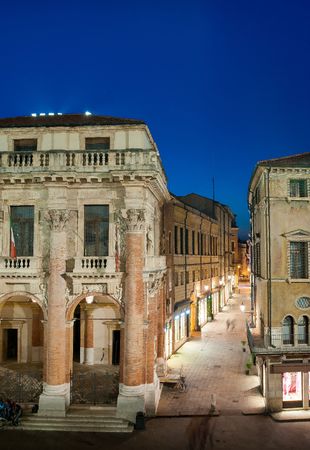 The Capitaniato palace by night seen from the facing Palladian basilica, Lords square, Vicenzaの写真素材