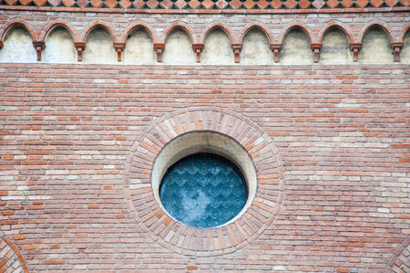 Rose window and pointed arch arcades in the external sides of the gothic Cathedral in Vicenza, Italyの写真素材