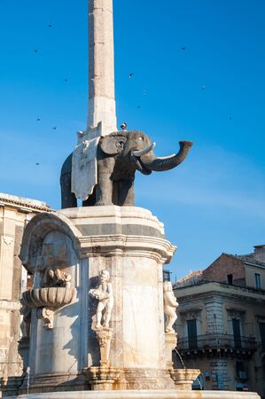 The famous lava stone statue of an elephant and its obelisk in Catania, Sicily, the symbol of the townの写真素材