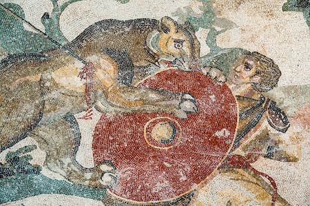 Mosaic of a hunt scene in the floor of the old roman Villa del Casale of the 4th century A.C. Unesco world heritage, Piazza Armerina, Sicilyの写真素材