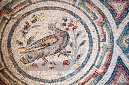 Closeup view of a bird and and motifs on the floor of the old roman Villa del Casale of the 4th century A.C. in the town Piazza Armerina, Sicilyの写真素材