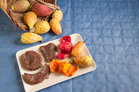 Prickly pears and some mustard shapes on a table