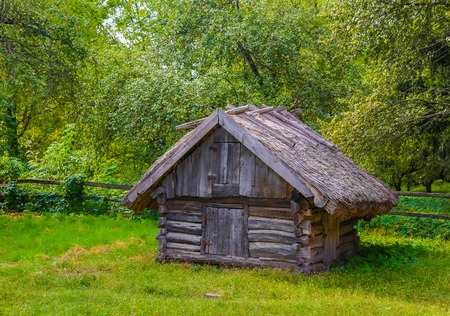Ancient traditional Ukrainian barn with a straw roof. Rural concept.の写真素材