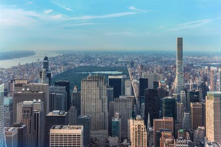 New York City Manhattan street aerial view with skyscrapers, pedestrian and busy traffic. The view...