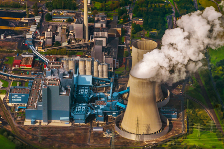 Schmehausen, Germany - September, 2017: Aerial view of clouds of smoke and steam coming from power station. Cooling towers, aerial view. Aerial view of power station. Power plant. Aerial view new modern power station.のeditorial素材