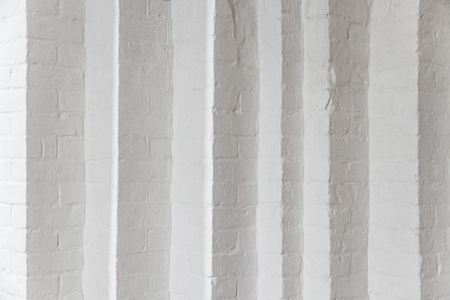 White brick wall with many corners. White room with white brick wall in the Gothic temple. Corner...