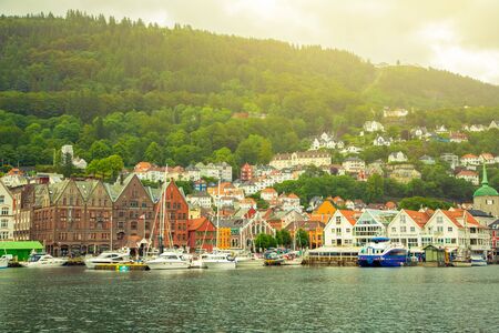 Bergen, Norway - Jule, 2016: View of the city of Bergen on the background of mountains.のeditorial素材