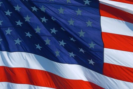 AMERICAN FLAG BACKGROUND, CLOSEUP: American flag USA Close Up waving background texture. American Flag Waving. Beautifully waving star and striped American flagの写真素材